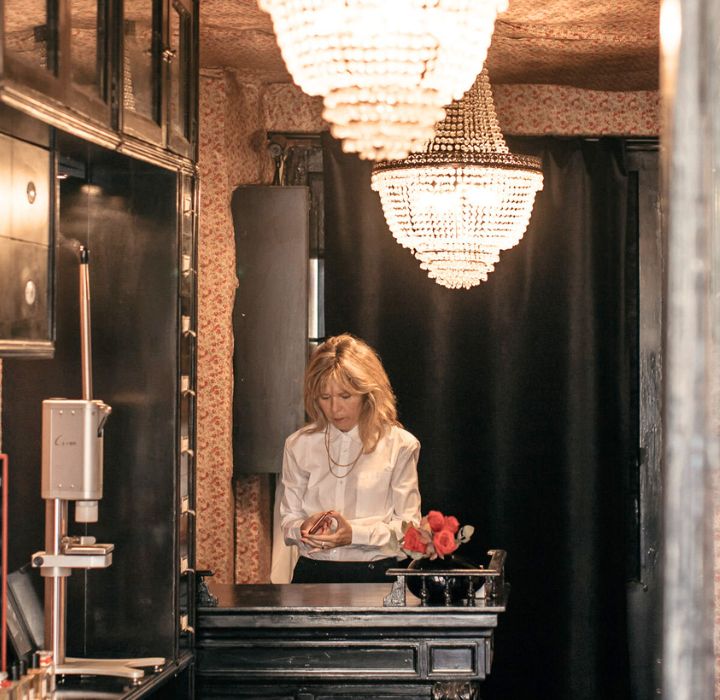 Perfumer Stéphanie de Bruijn is working in her boutique in Paris. A large chandelier lights up the scene